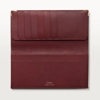 Carteira Internacional com Foldas, Must De Cartier – Pele de bezerro cor de vinho, acabamento dourado – Cartier