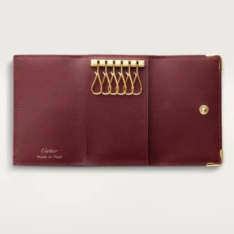 Porta-chaves de 6 chaves, Must De Cartier – Pele de bezerro cor de vinho, acabamento dourado – Cartier